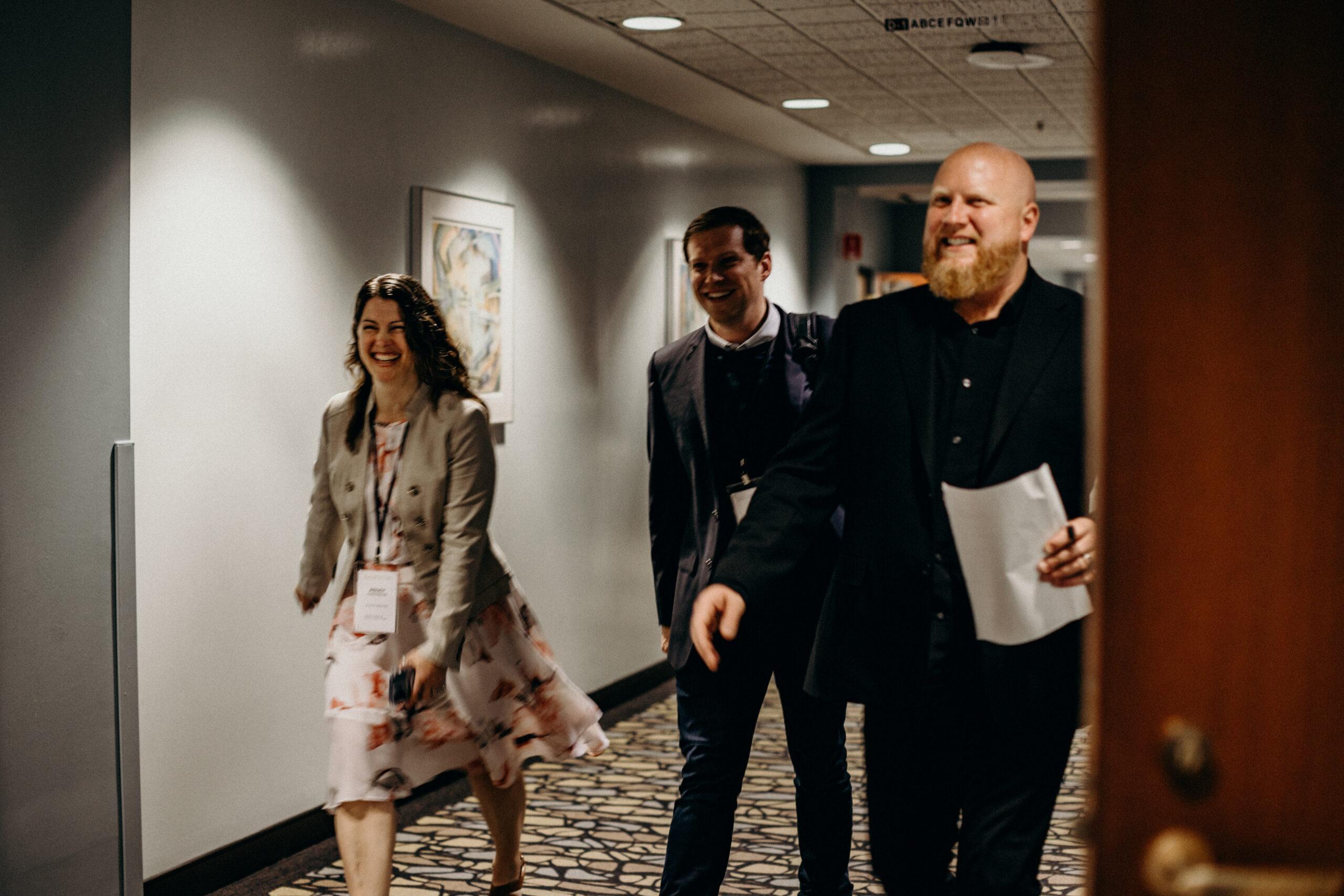 A group of Titus executives walking down the hall